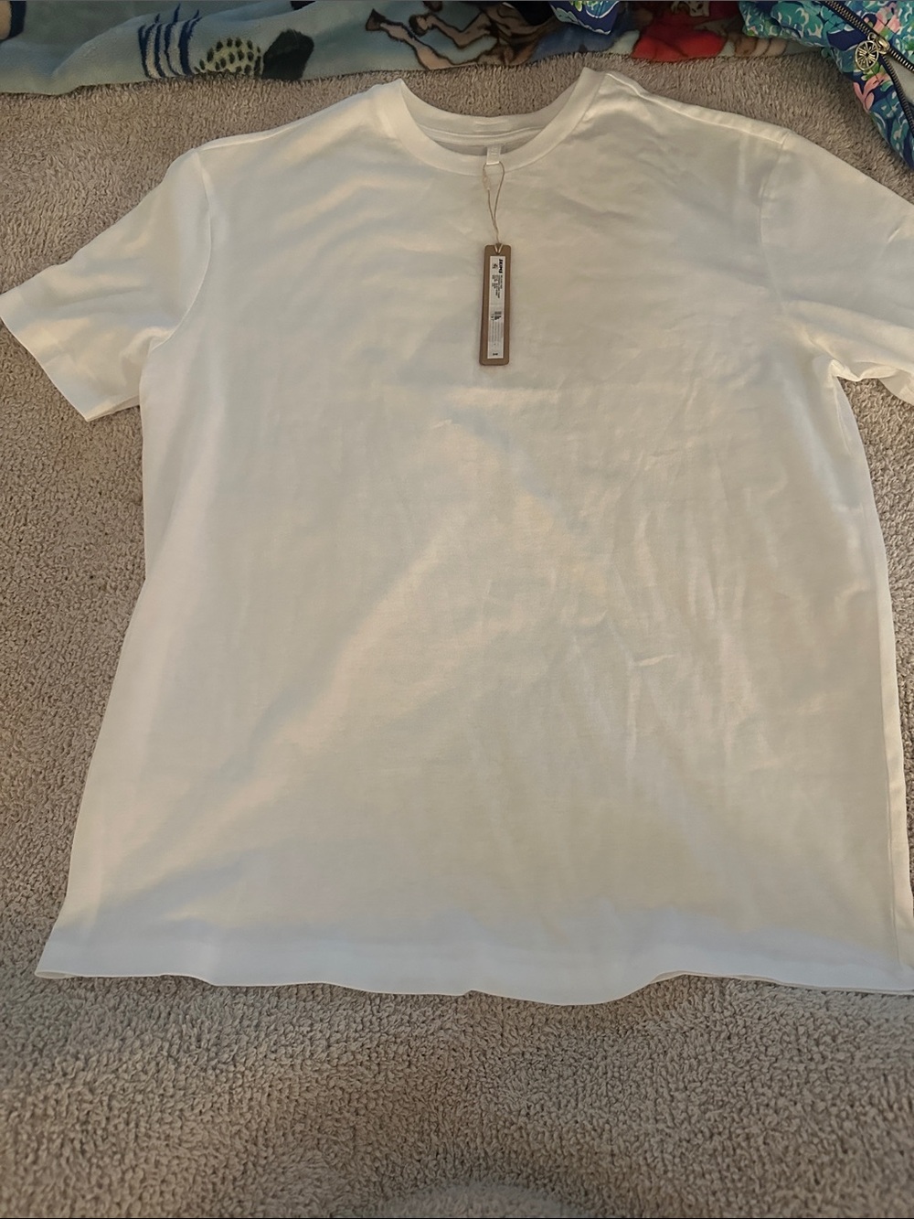 Skims relaxed oversized long T-shirt. XXS in snow, could fit s/m. NWT